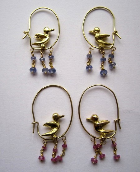 Hooped
                    singing bird earrings