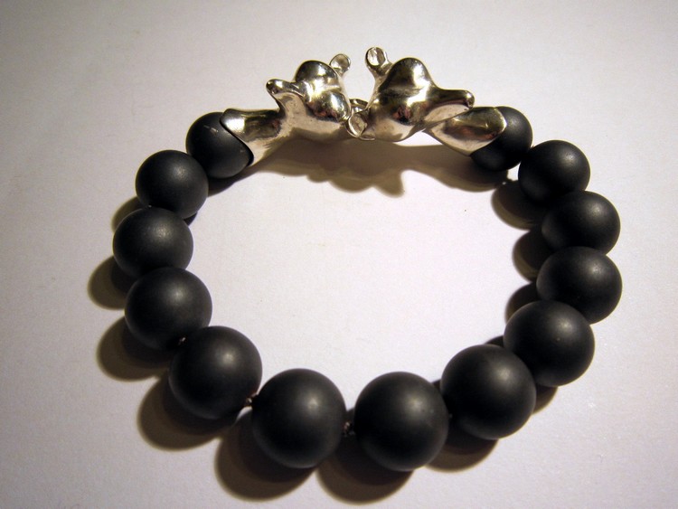 Silver bracelet with hematite beads.